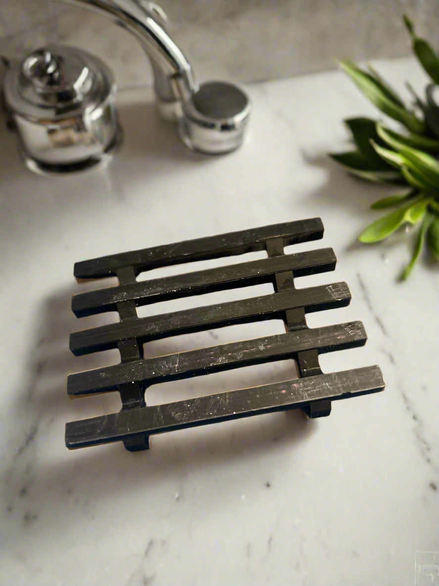 Metal grate on a textured gray surface